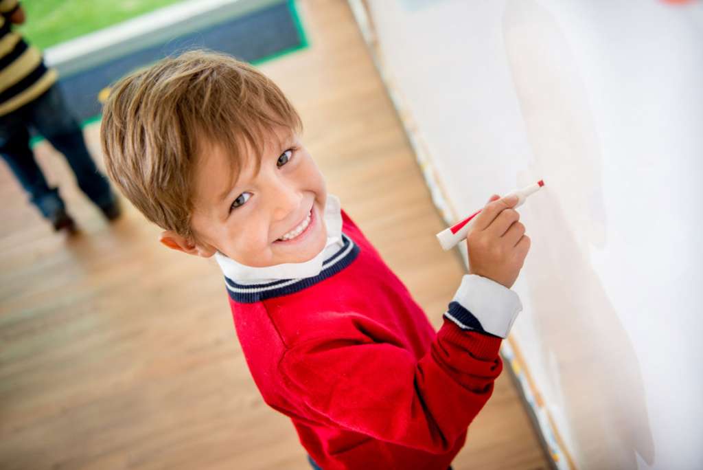 Grade2Student_DrawingOnWhiteboard